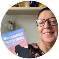 Bettina holding her copy of Conversations with Companions